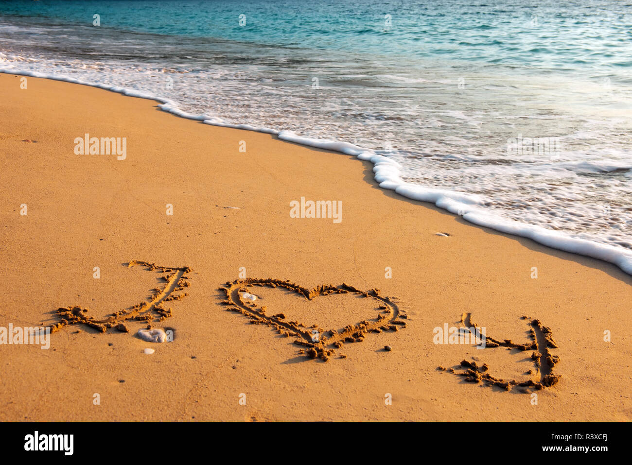 Nachricht Ich liebe dich auf Sand Strand Stockfoto