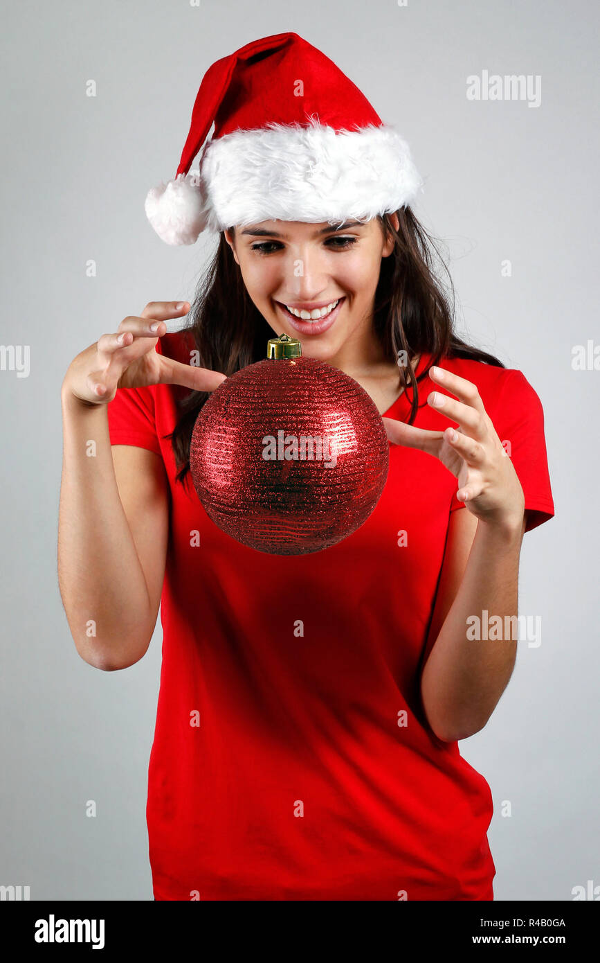 Magische santa Mädchen schwebt ein christmas ball Stockfoto