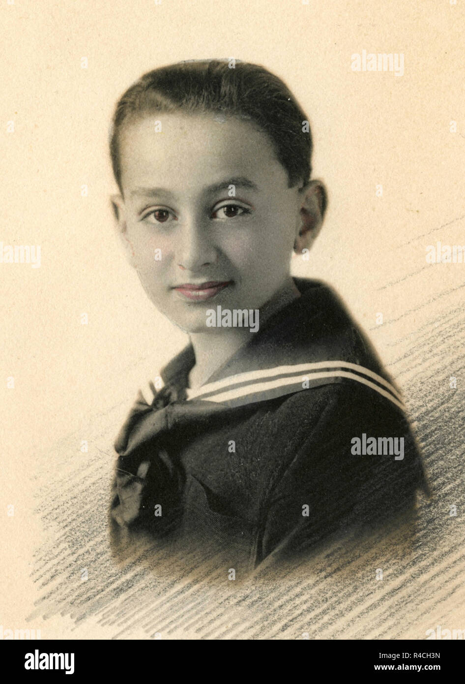 Handcolorierte altes Porträt eines Jungen, 1910 s Stockfoto