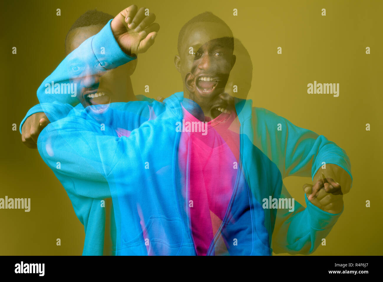 Doppelt belichtete Aufnahme der jungen afrikanischen Mann gegen grüner Hintergrund Stockfoto