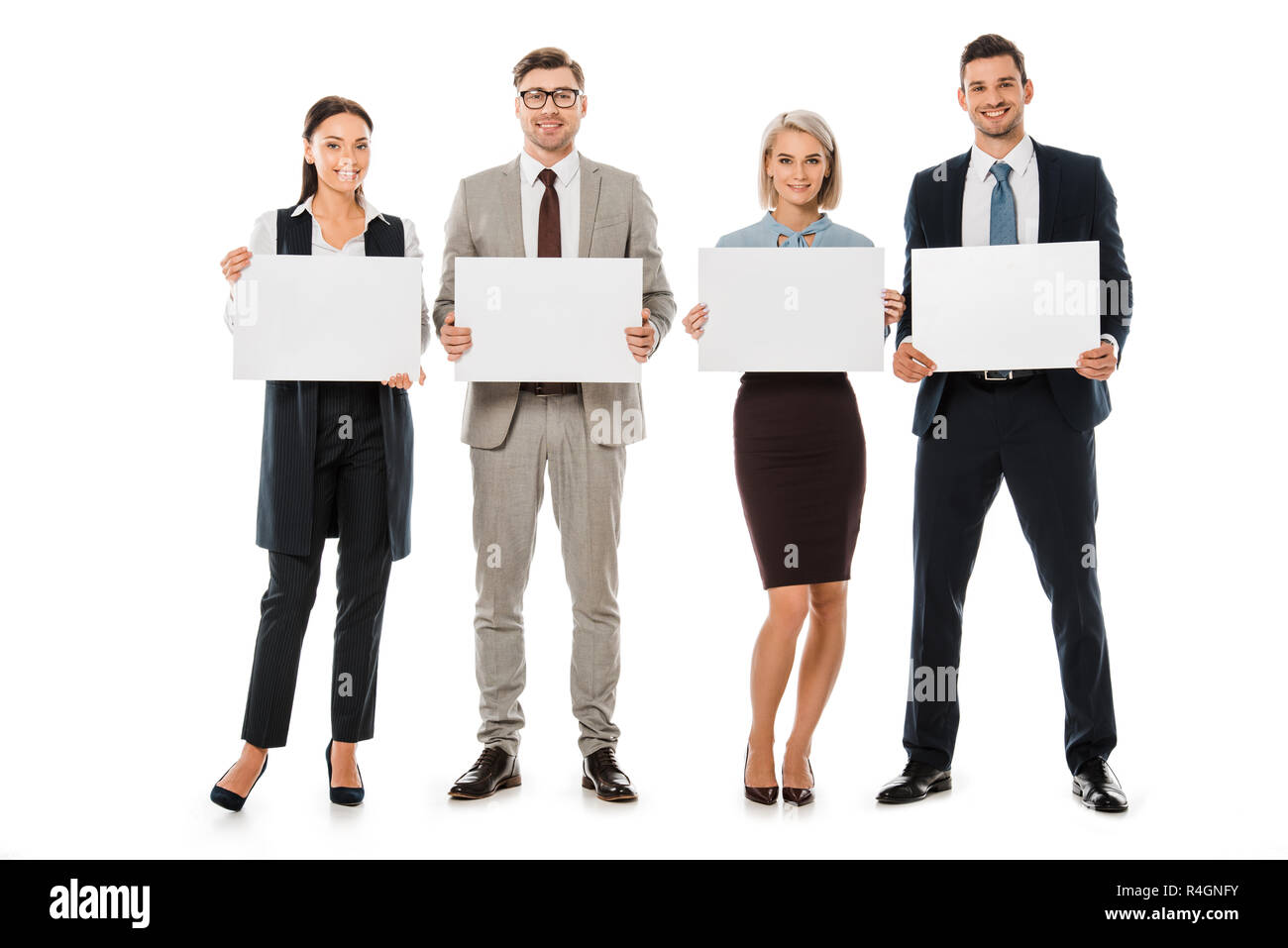 Lächelnd Business Team Holding leere Karten isoliert auf weißem Stockfoto