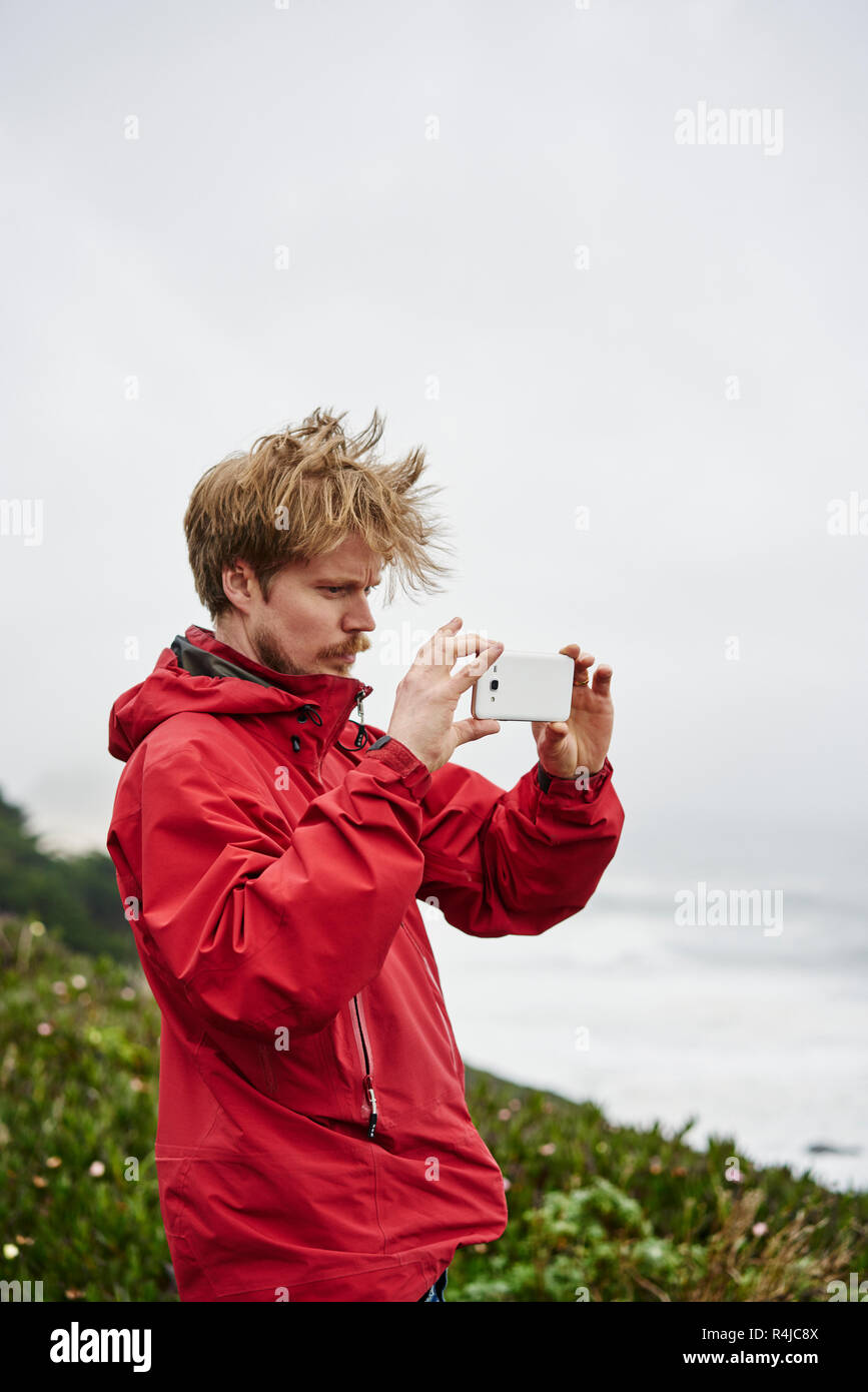 Menschen machen Fotos bei Big Sur in Kalifornien, USA Stockfoto