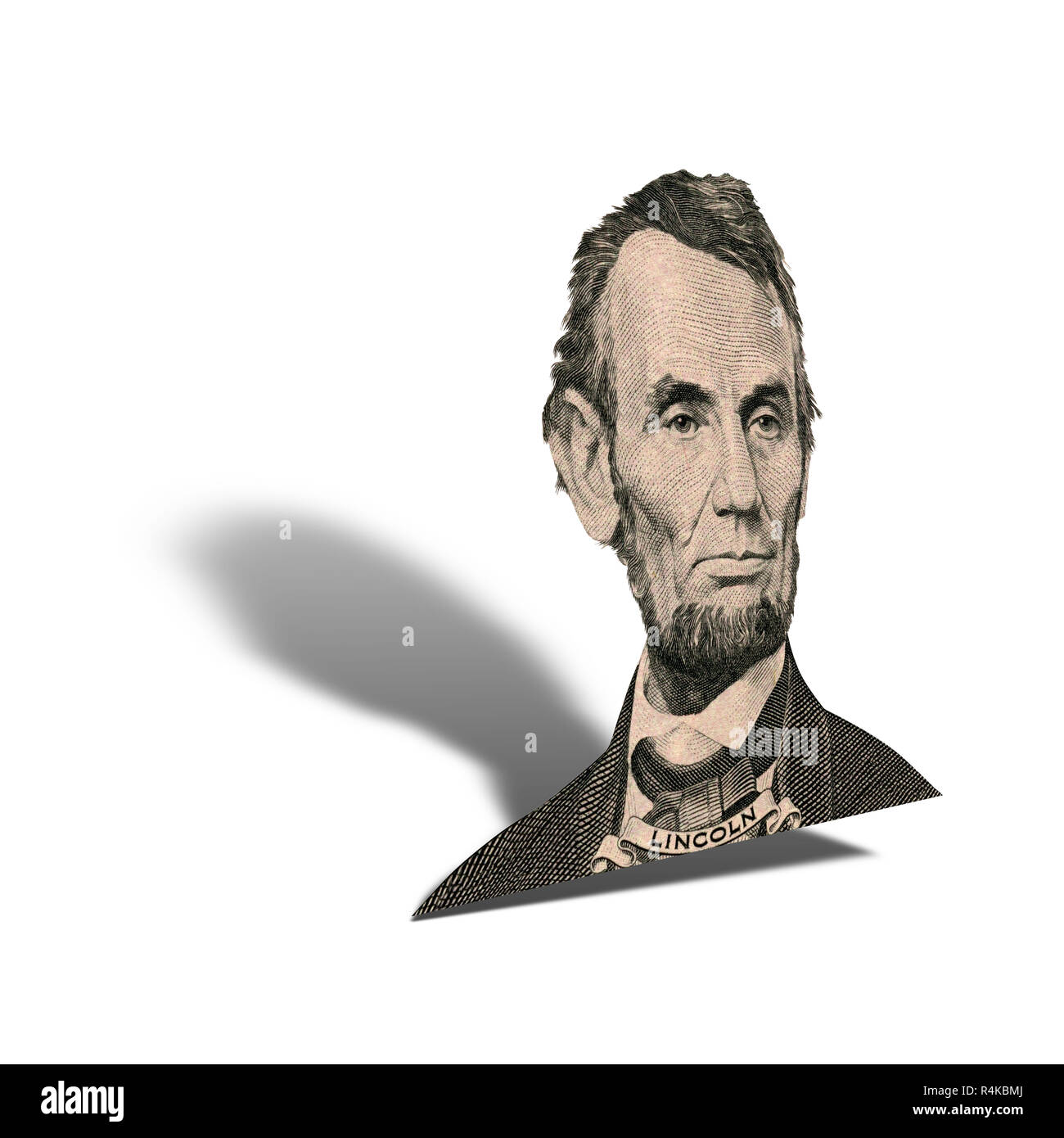 Portrait des ehemaligen US-Präsident Abraham Lincoln, wie er schaut auf fünf Dollar bill Vorderseite. Foto in einem Winkel von 45 Grad, mit Schatten. Stockfoto