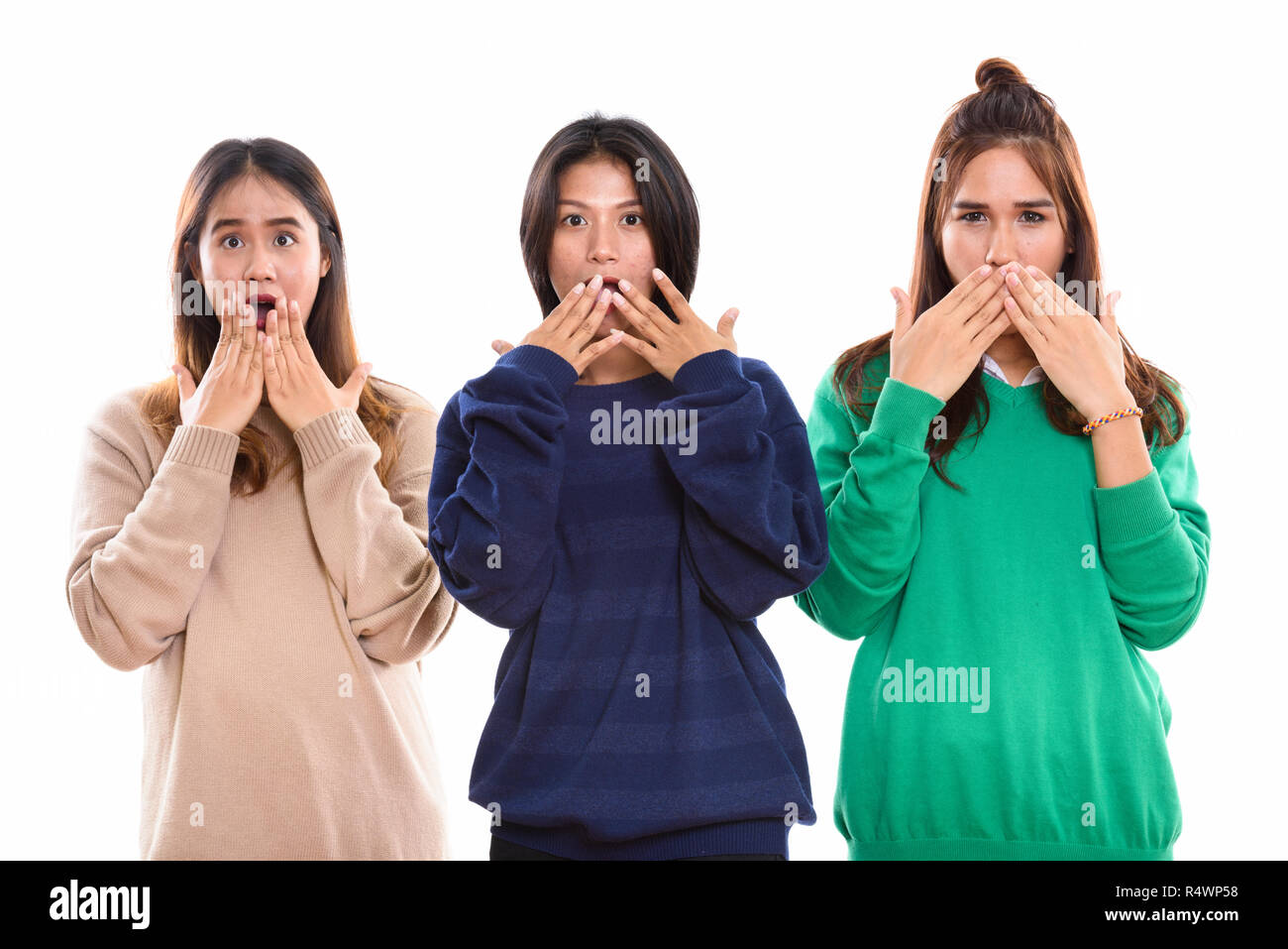 Studio geschossen von drei junge asiatische Frau Freunde für Mund wh Stockfoto