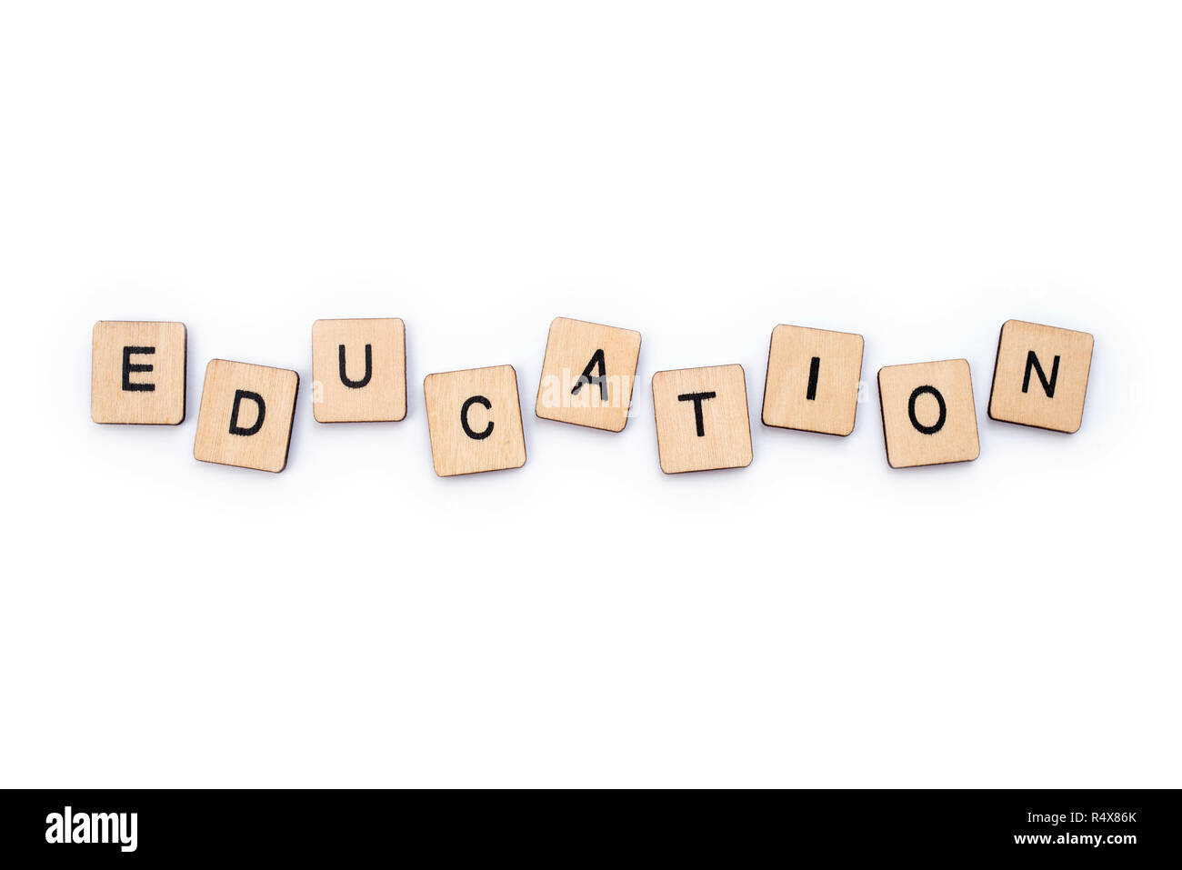 Das Wort Bildung, Dinkel mit hölzernen Buchstabensteine. Stockfoto