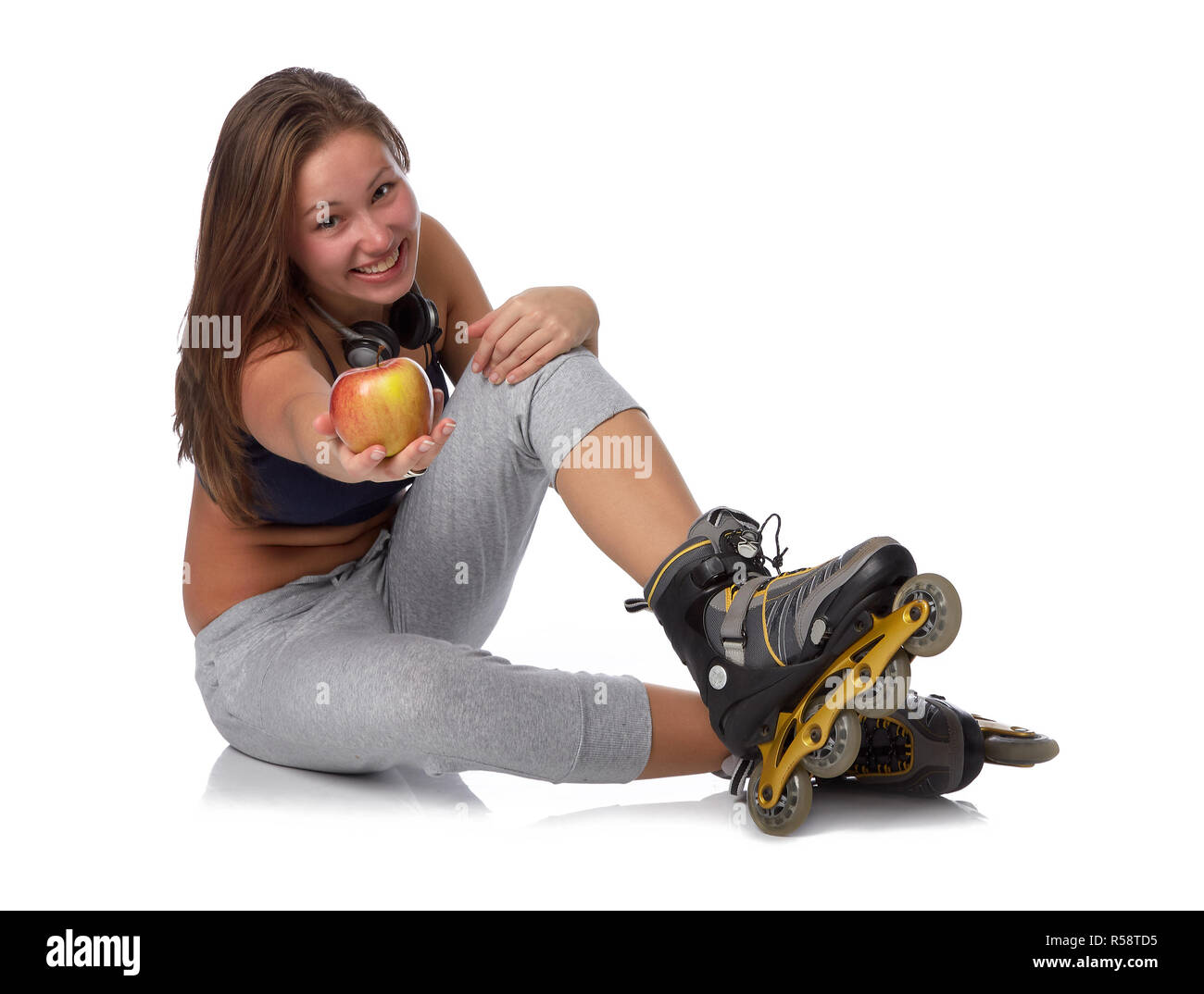 Das schöne Mädchen in rollerskates Stockfoto