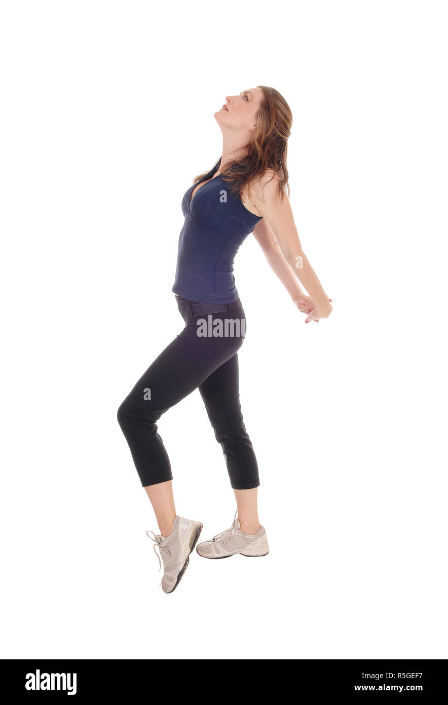 Schlanke Frau im Profil, Stretching. Stockfoto