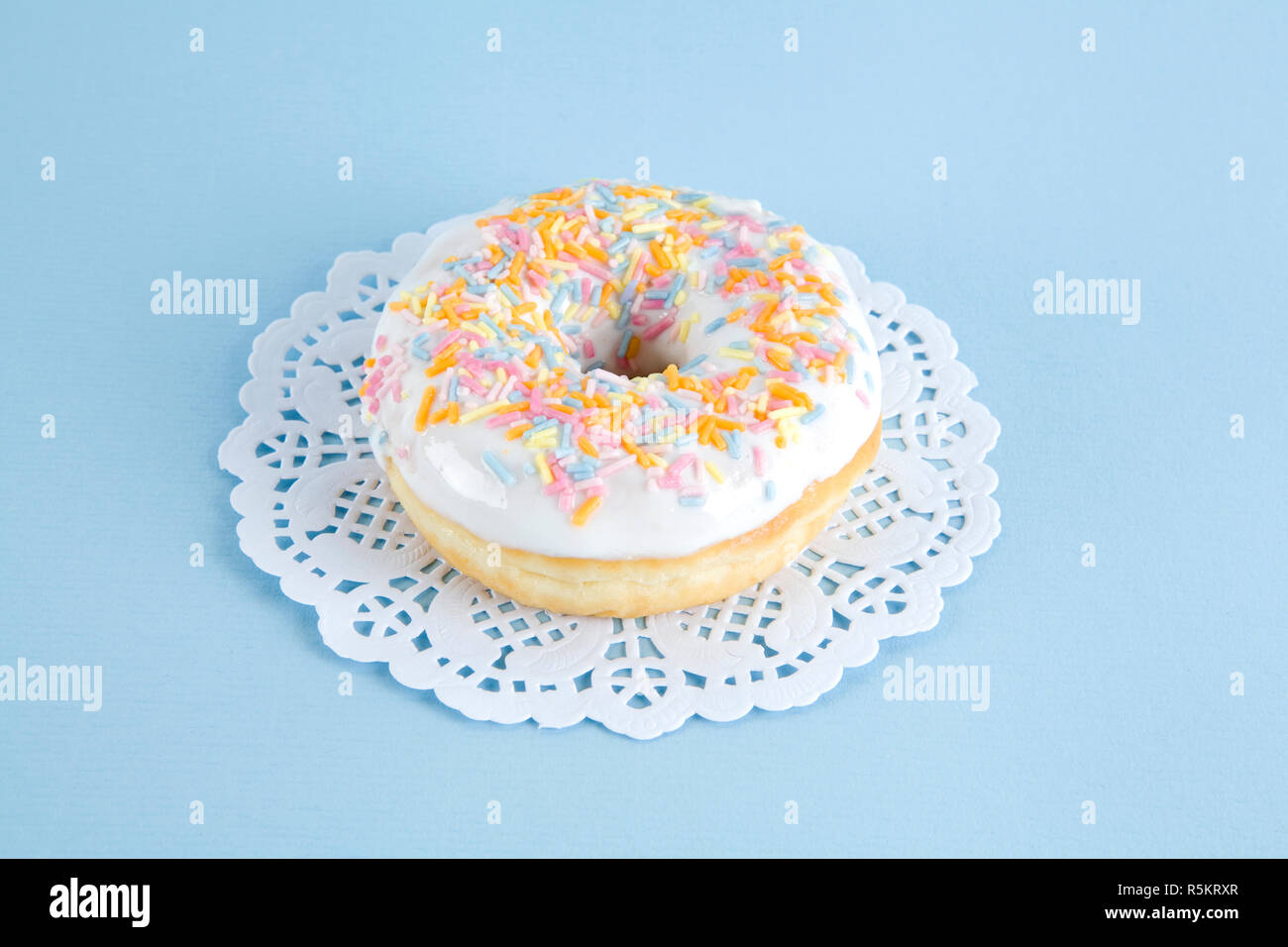 Deckchen bunte Donuts Stockfoto
