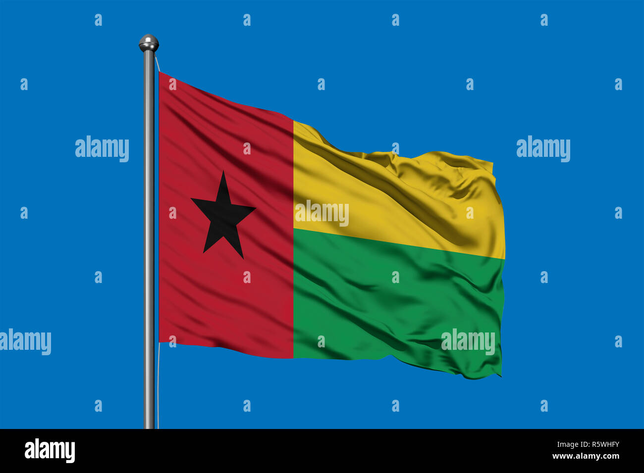 Flagge Guinea-bissau winken im Wind gegen den tiefblauen Himmel. Flagge Guineas. Stockfoto