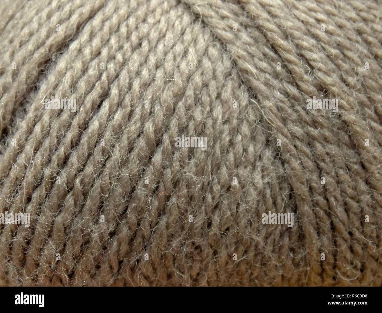 Wolle Knäuel Thema Handwerk grauer Hintergrund Textur Fibre Makro Stockfoto