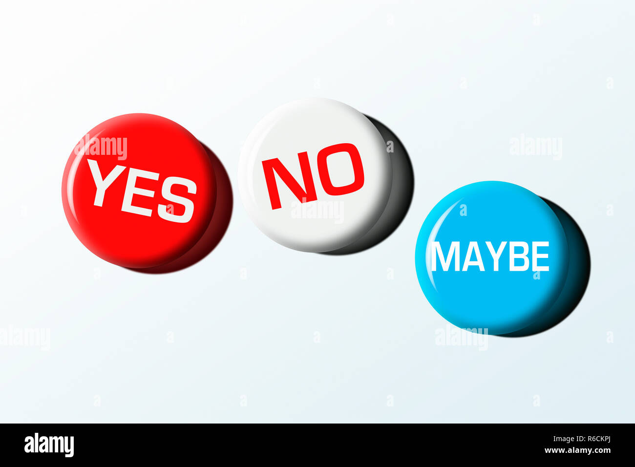 Drei Abzeichen mit 'Ja', 'Nein' und 'vielleicht' vor einem weißen Hintergrund Stockfoto