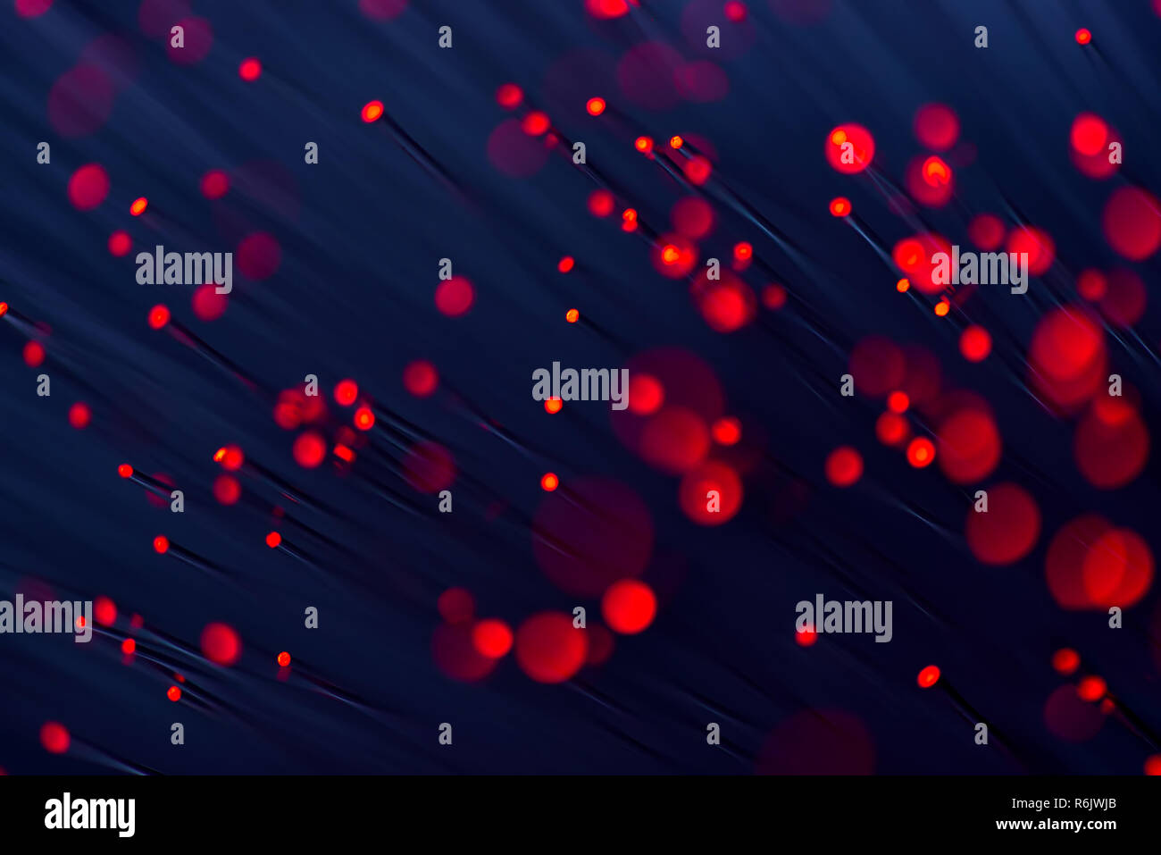 Fiber Optik in Rot, hautnah mit Bokeh Stockfoto