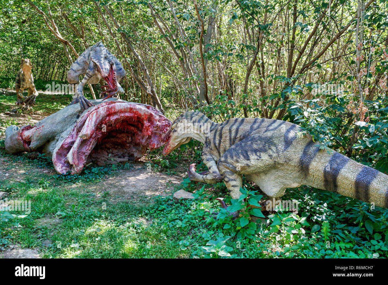 Prähistorische Dinosaurier raptors Angriff auf seine Beute Stockfoto