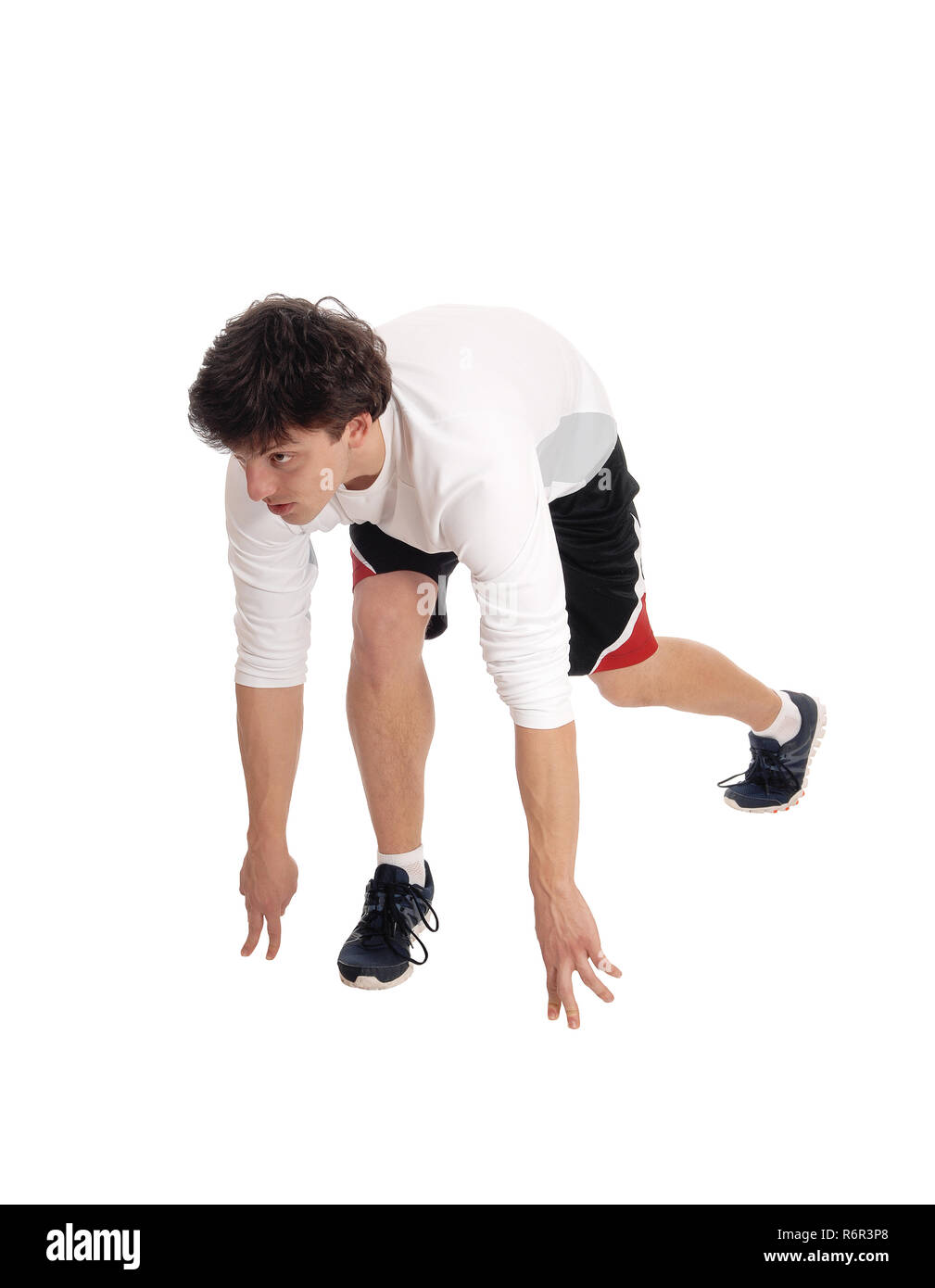 Junge Mann in der Start-Position für einen Lauf Stockfoto