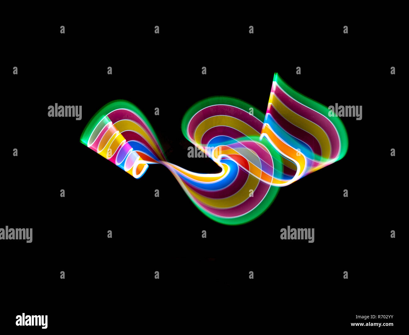 Abstrakte Bewegung leuchtet im Dunkeln Pastellfarben Stockfoto