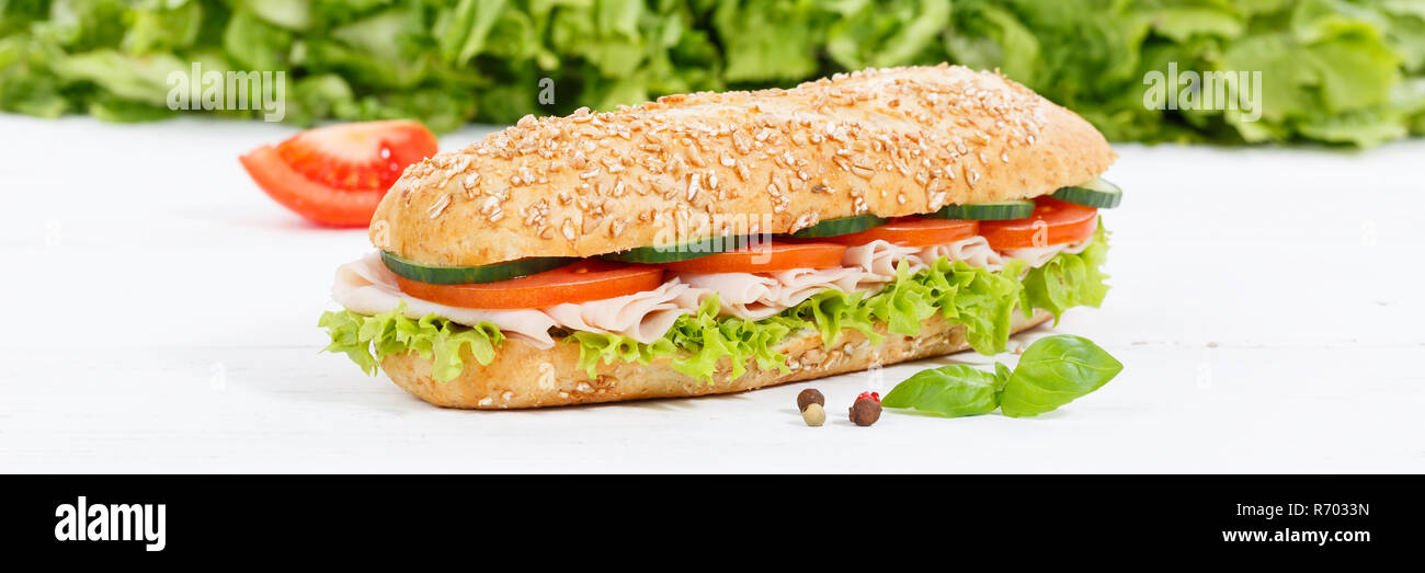Sandwich baguette Vollkorn Brötchen mit Schinken Banner auf Holzbrett gekrönt Stockfoto