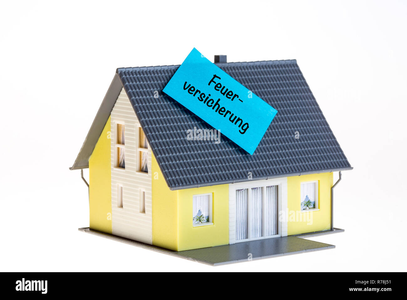 Symbol für Immobilien Brand- versicherung in deutscher Sprache Stockfoto