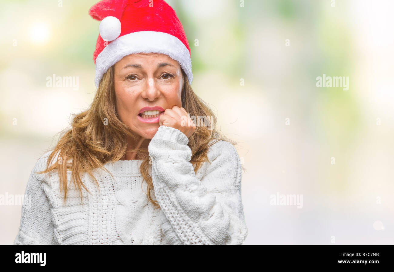 Mittleres Alter senior Hispanic Frau tragen Mütze über isolierte Hintergrund gestresst und nervös mit den Händen auf den Mund Beißen Nägel. Angst Stockfoto