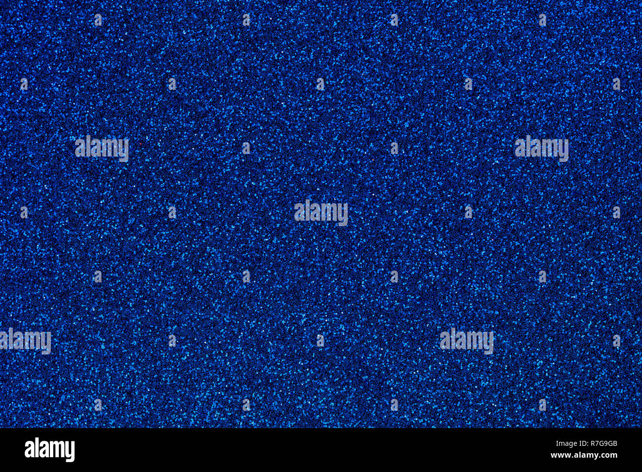 Marine blau gefärbten sand Papier strukturierten Hintergrund mit funkelt und glänzt. Stockfoto