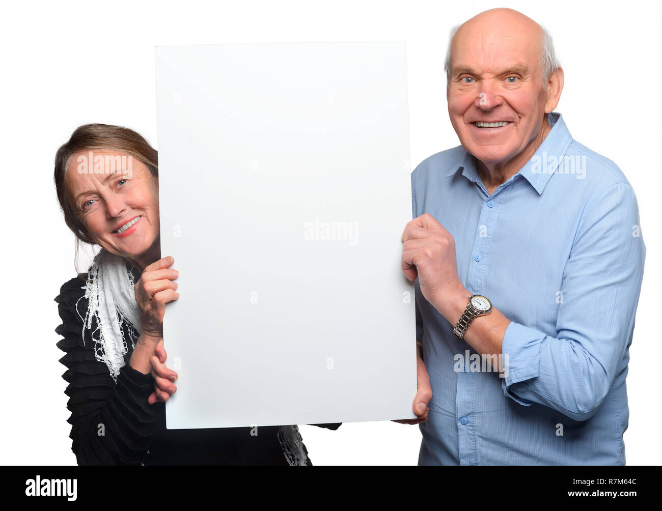 Großeltern pose mit leeren Plakat Stockfoto