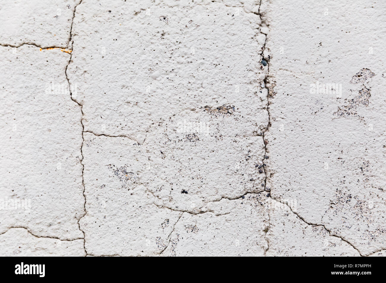 Close up details der alten Steinmauer Oberfläche mit Unebenheiten und Risse. Stockfoto