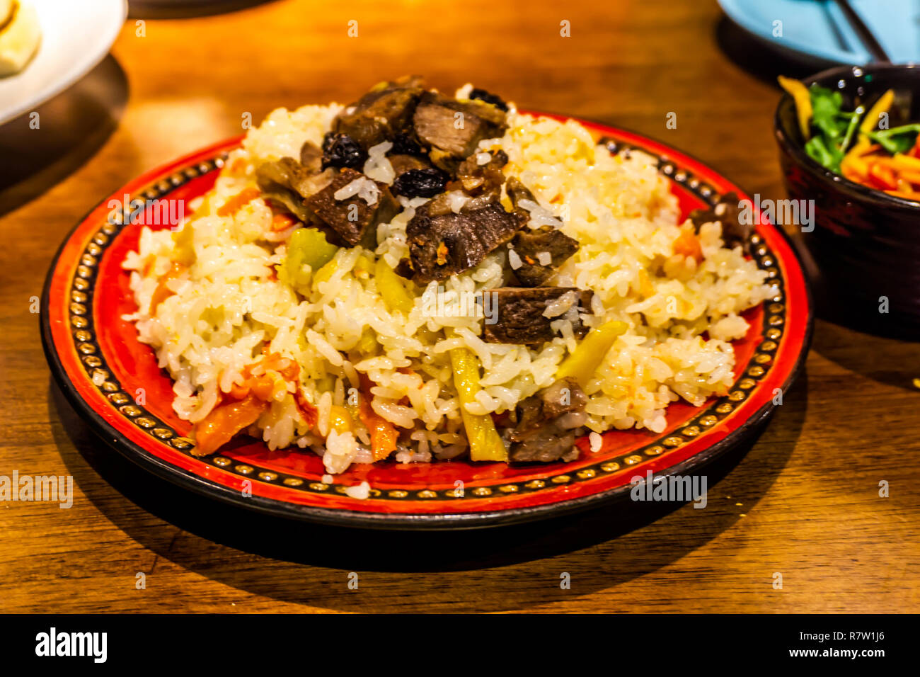 Chinesische Xinjiang Uyghur Pilav mit Karotten Reis und Lamm Stockfoto
