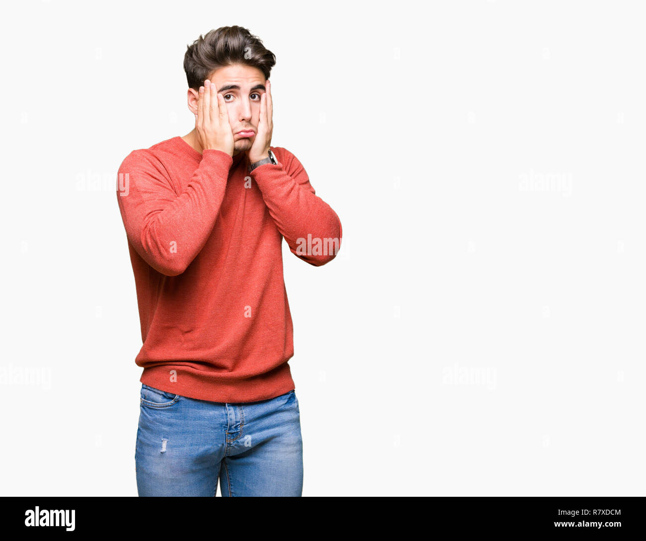 Jungen gutaussehenden Mann über isolierte Hintergrund müde Hände, Gesicht, Depression und Traurigkeit, traurig und ärgerlich für Problem Stockfoto