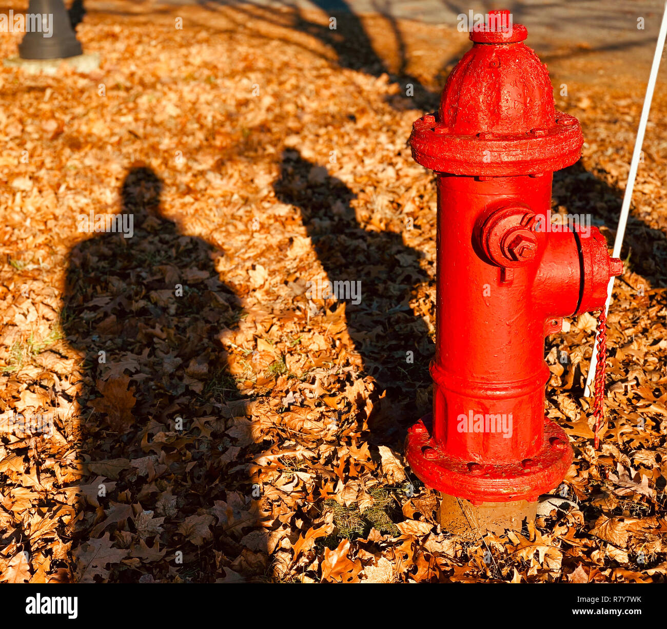 Hydranten und der Schatten eines Mannes Stockfoto