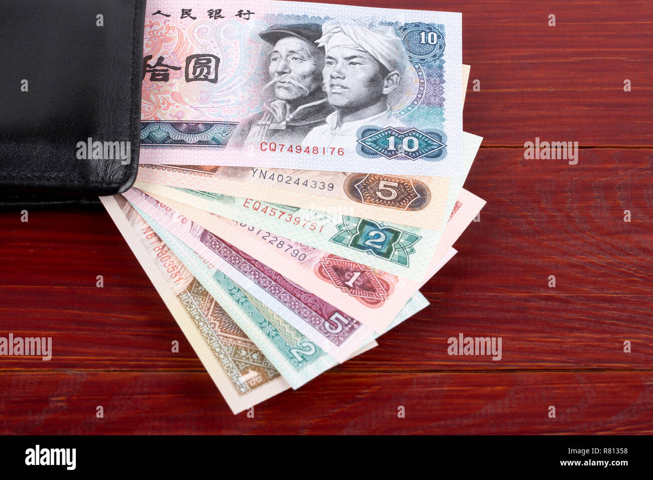Alte chinesische Geld in der schwarzen Mappe Stockfoto