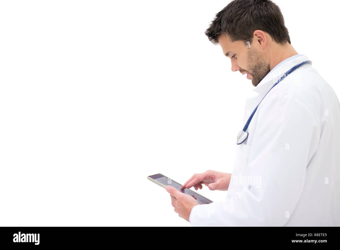 Junge männliche Arzt mit digitalen Tablet. Stockfoto