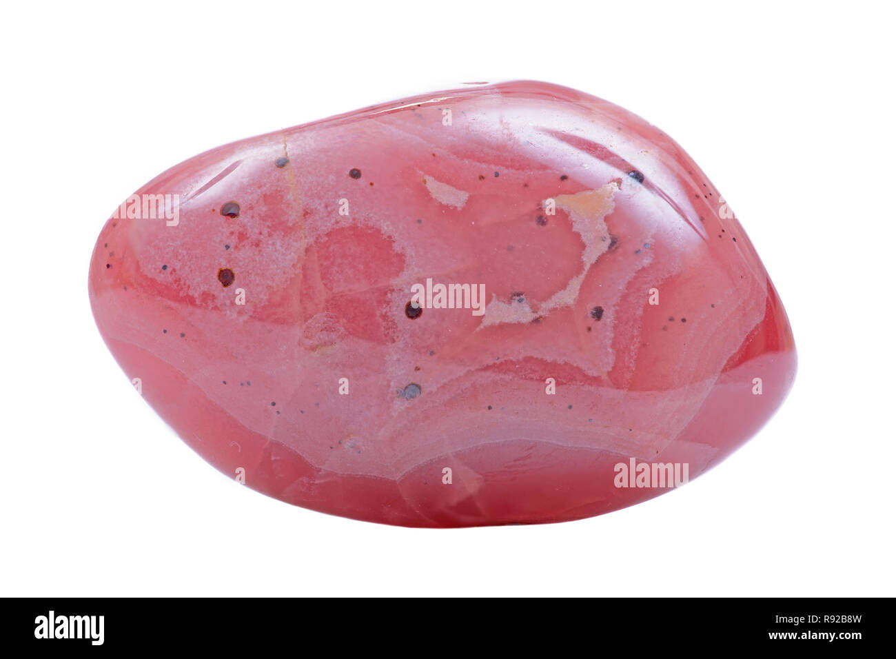 Hochwertige polierte gebändert Rhodochrosit aus Argentinien isoliert auf weißem Hintergrund. Stockfoto
