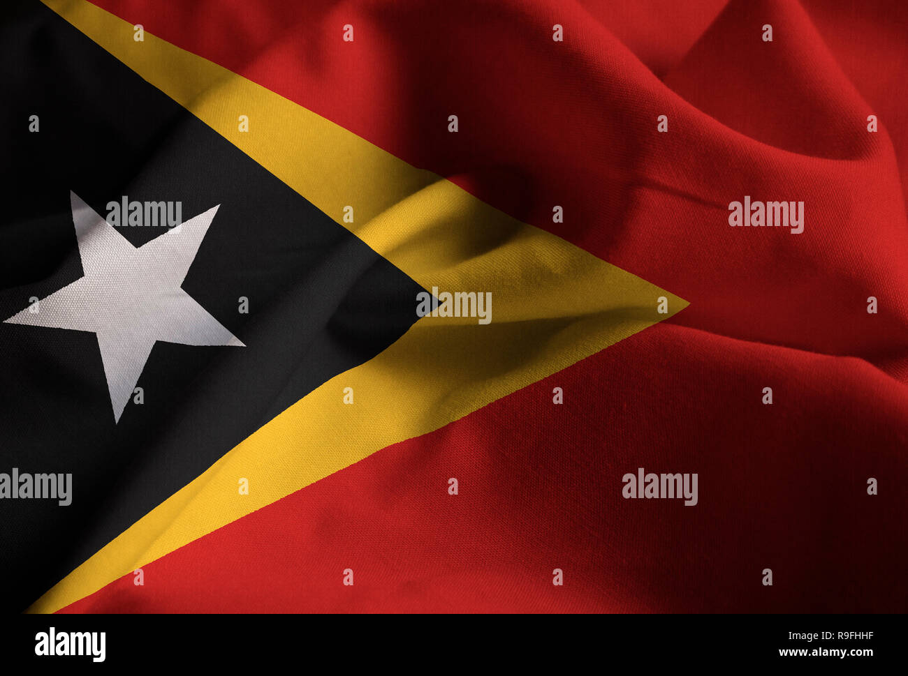 Nahaufnahme von gekräuselten Osttimor Flagge, Osttimor Flagge weht im Wind Stockfoto