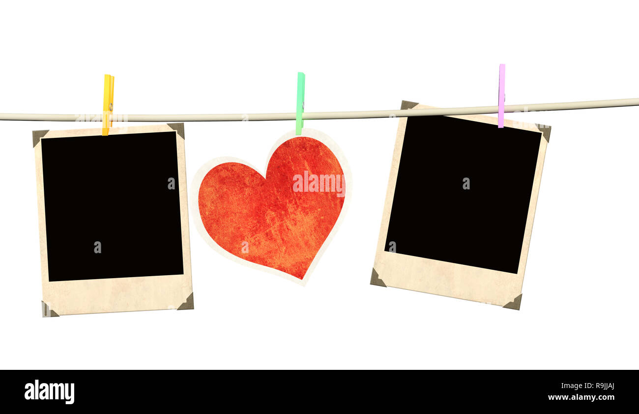 Alte Fotos und Herz aus Papier. Über weiß Isoliert Stockfoto