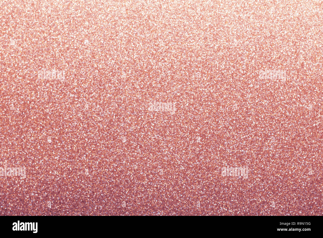 Rose gold glitzer Hintergrund, glänzendes Geschenkpapier defokussierten  Stockfotografie - Alamy