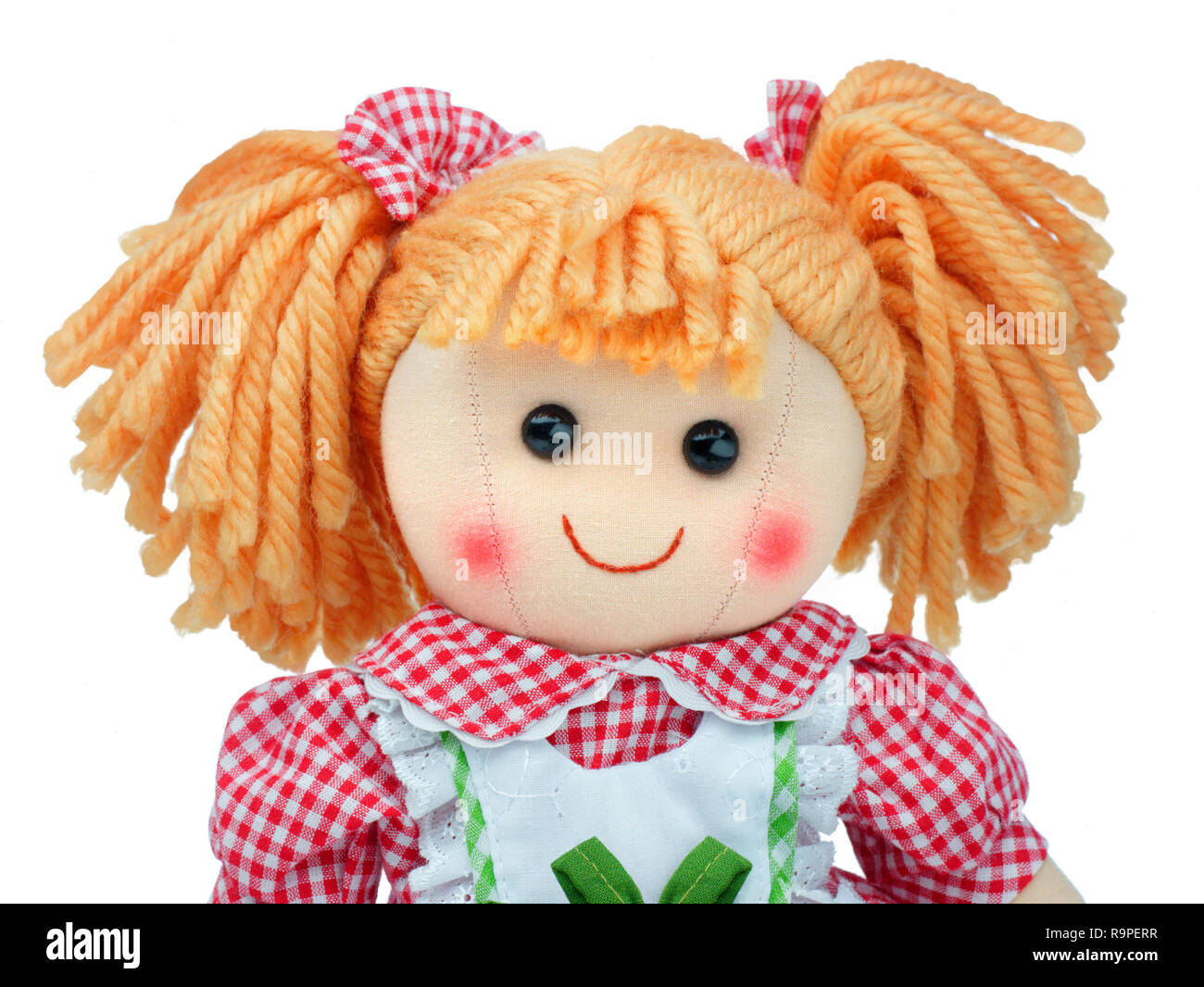 Lächelnde niedliche Stoffpuppe portrait isoliert Stockfoto