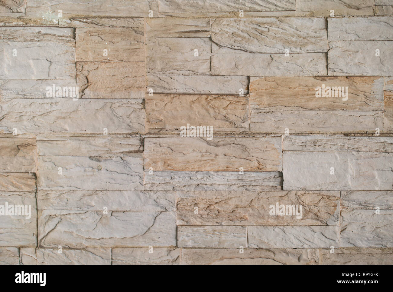 Textur von braunem Stein - Fliesen Granit an der Wand Stockfoto