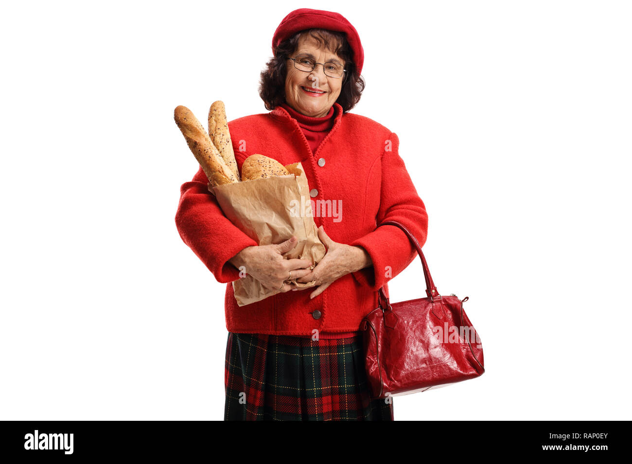 Ältere Frau, die eine Tasche mit Brot Laibe auf weißem Hintergrund Stockfoto