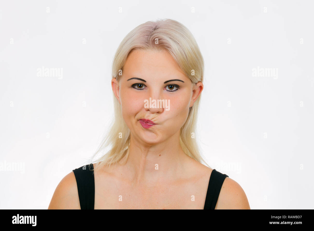 Gesicht Übung für Frauen grinsen, Frau ihre Lippen Verschiebung nach rechts Stockfoto