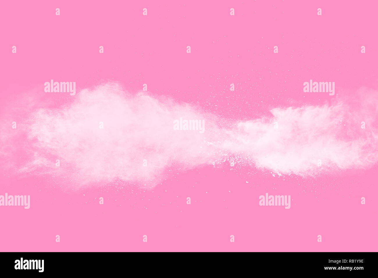 Weißes Pulver Explosion auf rosa Hintergrund. Stockfoto