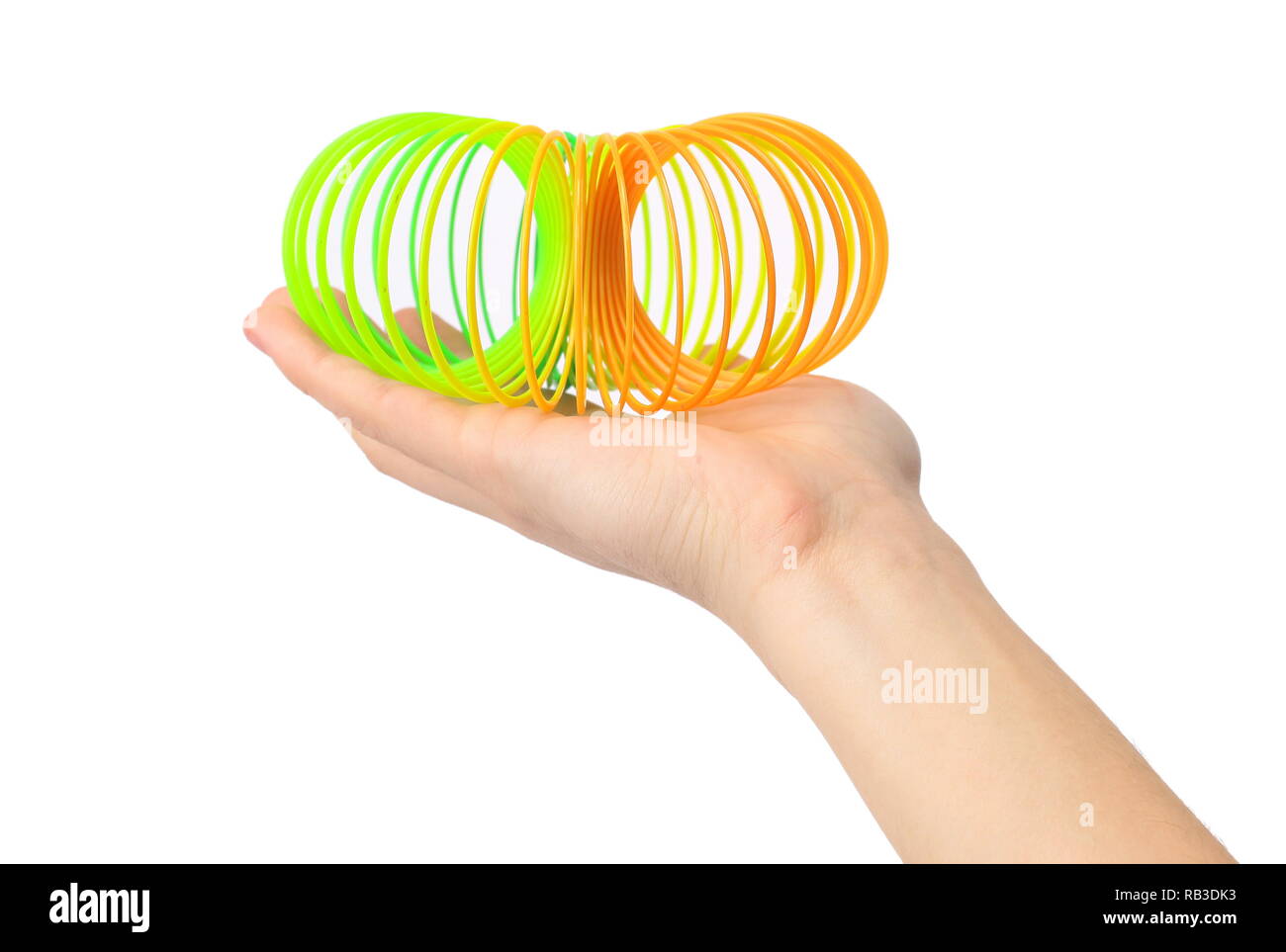 Bis zu schließen. Spielzeug Spirale in weiblicher Hand. auf weißem isoliert  Stockfotografie - Alamy