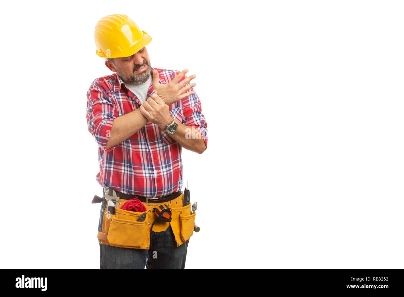 Betroffenen builder Kontrolle schmerzhafte Handgelenk verstaucht als körperliche Arbeit Konzept auf weißem Hintergrund Stockfoto