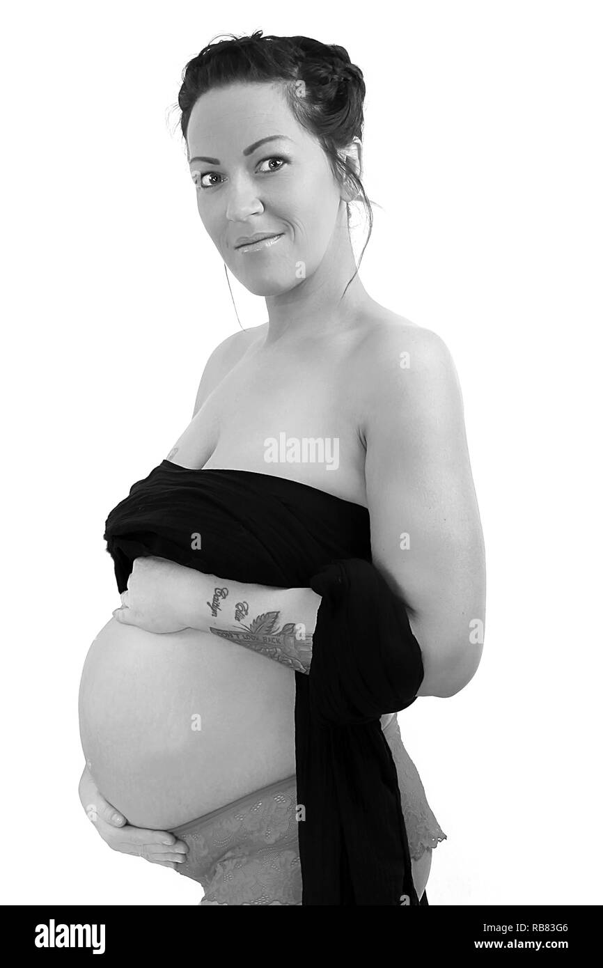 Schwangere Frau berühren Babybauch Stockfoto