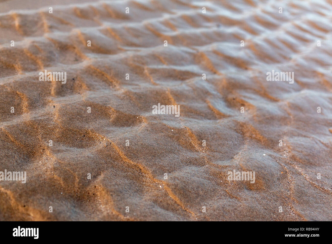 Mikrostrukturen in der Sand des Meeres geformt Stockfoto