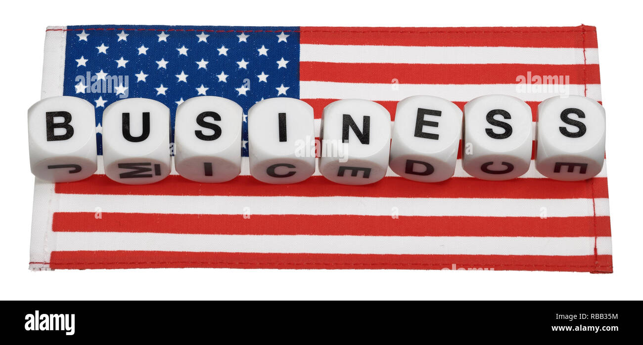 Das Wort, das Geschäft, das auf eine amerikanische Flagge geschrieben Stockfoto