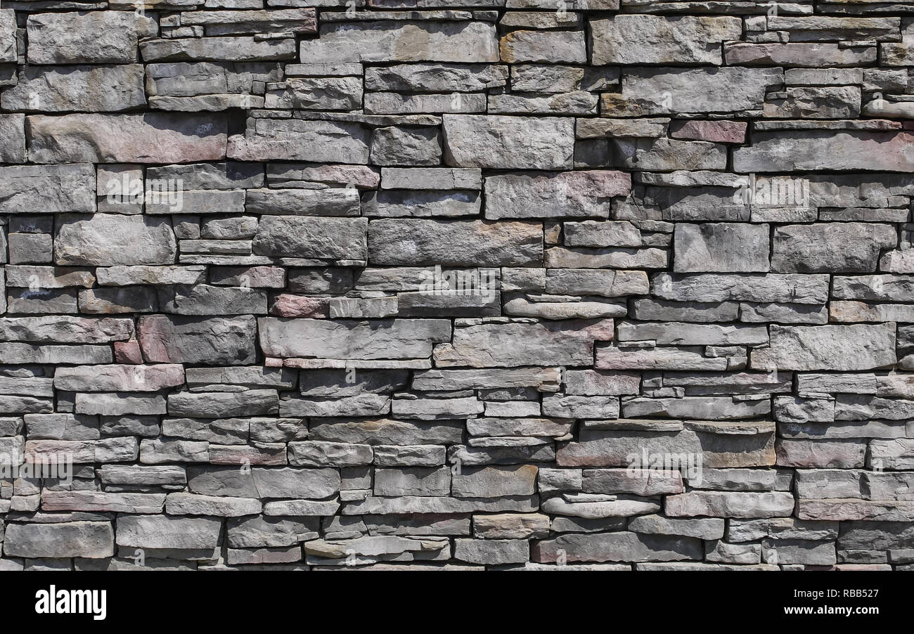 Dekorative Muster der Steinmauer Oberfläche. Stein Hintergrund Textur. Stockfoto