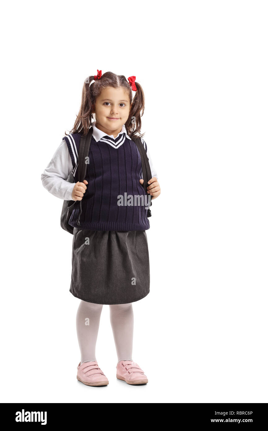 In voller Länge Porträt eines kleines Schulmädchen in einem einheitlichen an der Kamera auf weißem Hintergrund suchen Stockfoto
