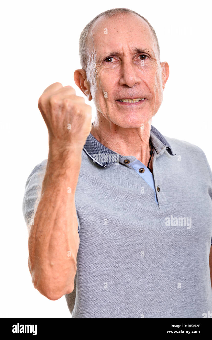 Studio shot der verärgerten älterer Mann mit Arm angehoben Stockfoto