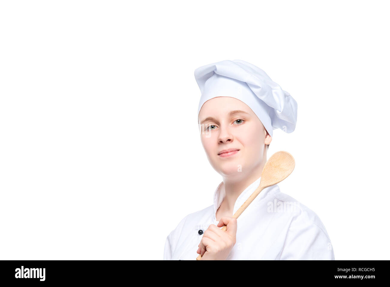 Isolierte Portrait eines glücklichen träumen Kochen mit einem Holzlöffel, ein Ort für die Inschrift auf der linken Seite Stockfoto