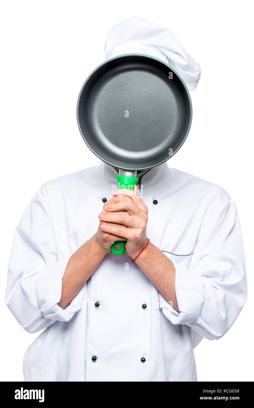 Koch verbirgt sein Gesicht hinter dem Pan, das Porträt ist isoliert Stockfoto