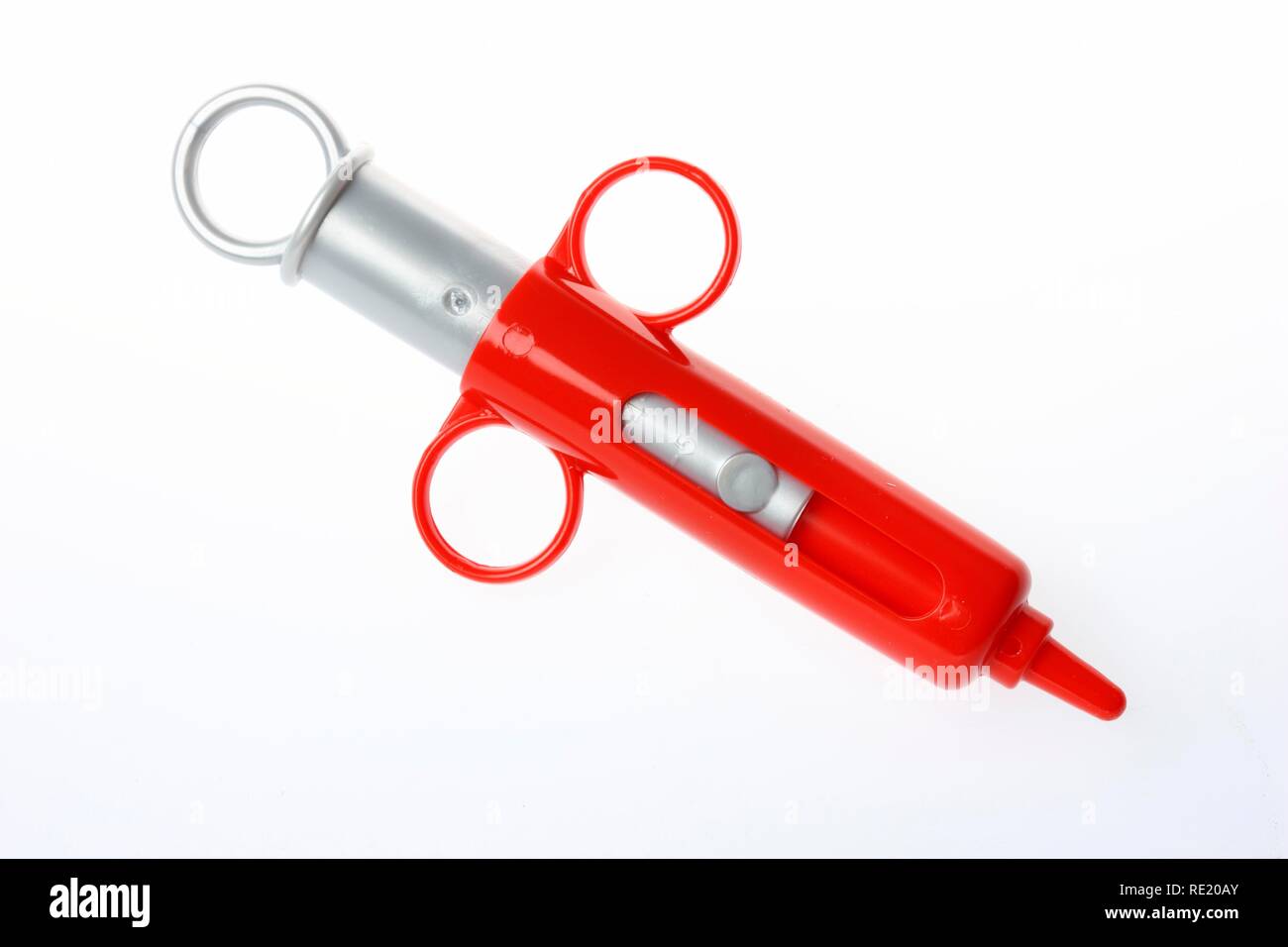 Spritze, Spielzeug für Kinder, aus der Tüte ist ein Arzt mit Spritze, Spielzeug für Kinder, aus der Tüte ist ein Arzt mit